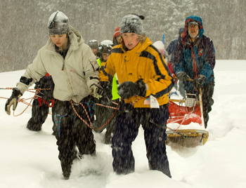 School kids working as the dogs at a Quest simulation.